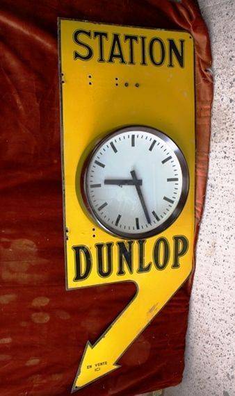 ARRIVING SOON Dunlop Double Sided Clock Enamel Sign