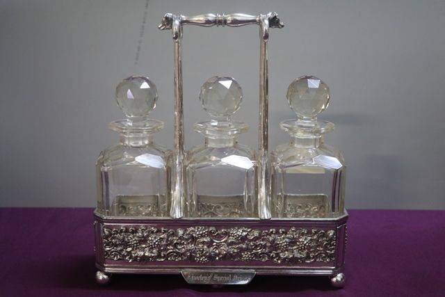 Antique Victorian Cut Glass 3 Bottle Tantalus in a Silver Plated 