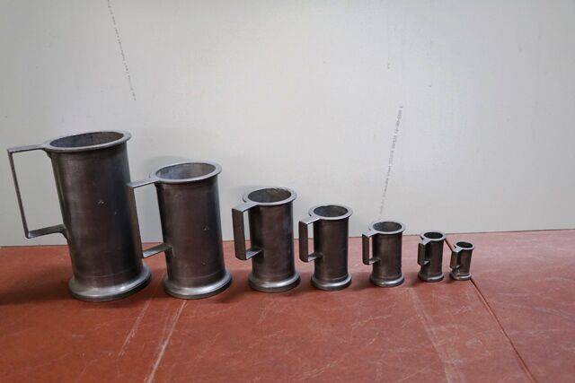 Graduated Set of and Seven Pewter Tankards 