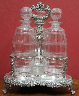 Victorian 3Bottle Tantalus on SilverPlated Stand