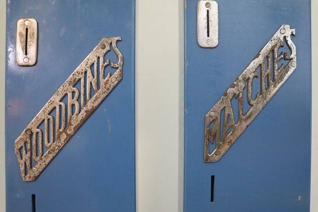 A Pair Of Wall Mounted Vending Machines FOr Matches + Woodbines Cigarettes 
