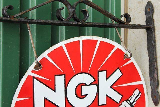 NGK Spark Plugs Enamel Double Sided Sign With Cast Bracket