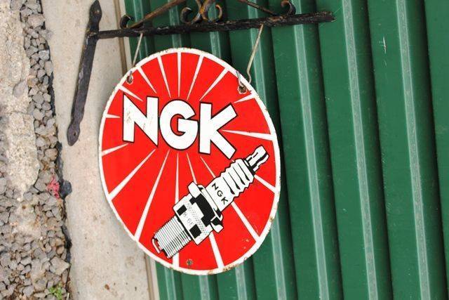 NGK Spark Plugs Enamel Double Sided Sign With Cast Bracket