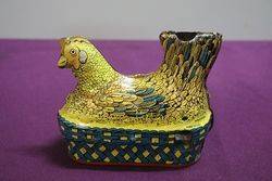 A Baldwin MFG Company Clockwork Tinplate Model Of A Hen Nesting 