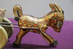 A Mark Toys Clockwork Tinplate Model Of A Donkey Pulling A Cart  