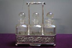 Antique Victorian Cut Glass 3 Bottle Tantalus in a Silver Plated 