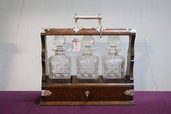 Cut Glass 3 Bottle Tantalus Housed in a Lockable Oak Case 