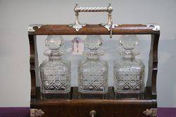 Cut Glass 3 Bottle Tantalus Housed in a Lockable Oak Case 