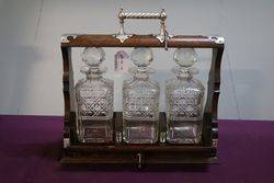 Cut Glass 3 Bottle Tantalus Housed in a Lockable Oak Case 