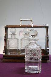 Cut Glass 3 Bottle Tantalus Housed in a Lockable Oak Case 