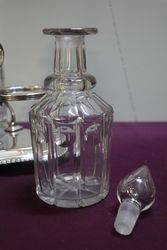 Cut Glass 3 Bottle Tantalus in a Silver Plated Stand