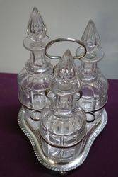 Cut Glass 3 Bottle Tantalus in a Silver Plated Stand