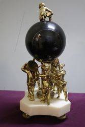 French Bell Strike Clock In Round Black Ball On top Of Cherubs 