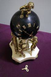 French Bell Strike Clock In Round Black Ball On top Of Cherubs 