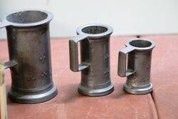 Graduated Set of and Seven Pewter Tankards 